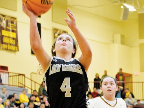 All Cherokee’s Alexis Smith could do was look on as Desta Trammell took flight for a second-half bucket Tuesday at Cherokee. Trammell had 42 points at Swain County on Jan. 19 and her 23-point evening at Cherokee pushed her to 1,603 career points. Photo by Kevin Hensley/sports@grahamstar.com