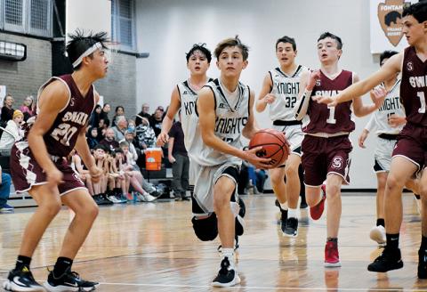 Robbinsville’s Eli Lambert (12) splits a pair of Maroon-Devil defenders during the Black Knights’ win over Swain County on Jan. 5. Photos by Kevin Hensley/sports@grahamstar.com