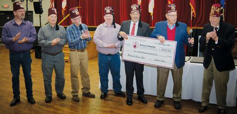 Robbinsville Shriner Martin Oehler is joined by members of the Robbinsville Shriner’s Club, as news of his generous contribution is announced at Oasis Shriners Headquarters in Charlotte on Jan. 6. From left are Robert Britton, Treasurer; Billy Clark, Past President; Jack Long, President; Leon Allen, Secretary; Keith “Beefy” Rogers, Oehler and Jerry Gantt, former CEO of Shriners International and current Chairman of the Board of Trustees for Shriners Children’s. Photo courtesy of Mike Harding/Genesis Photog