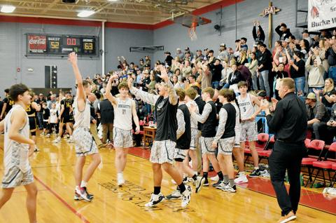 In junction with the players on the floor, the Black Knights’ passionate fanbase erupts inside the Ken Solesbee Athletic Center at the final buzzer Friday, as  Robbinsville wrapped up the 2022-23 Smoky Mountain Conference Tournament Championship by knocking off Murphy. Photo by Kevin Hensley/sports@grahamstar.com
