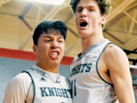Robbinsville juniors Xander Wachacha (left) and Donovan Carpenter erupt in celebration after Wachacha drew the and-one after completing a transition basket Monday. Wachacha and Carpenter accounted for 30 of the Black Knights’ 47 points in the Smoky Mountain Conference semifinals against Hayesville. Photos by Kevin Hensley/sports@grahamstar.com
