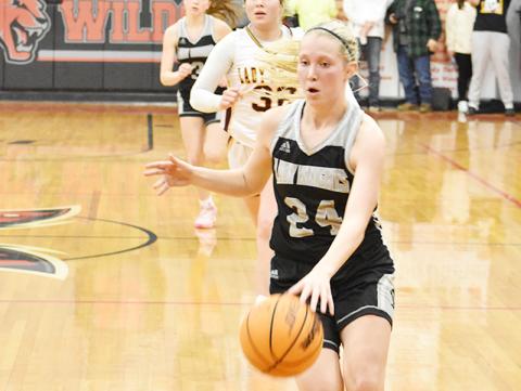 Robbinsville senior Kensley Phillips pulls away on a fast break during overtime of Feb. 16's Smoky Mountain Conference finals against Cherokee. Photo by Kevin Hensley/sports@grahamstar.com