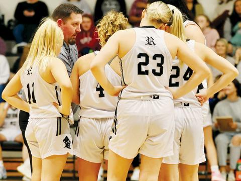 Lady Knights head coach Lucas Ford goes over some final instructions just before tip-off Friday against Hayesville, with his starting line-up (from left): Suri Watty, Desta Trammell, Liz Carpenter, Kensley Phillips and Aubrie Wachacha. Robbinsville will enter the Smoky Mountain Conference tournament at Andrews with a No. 2 seed. Photo courtesy of Miranda Buchanan/Robbinsville High School Yearbook