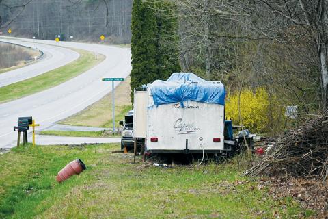 A resident parked this Coachmen RV on the side of N.C. Hwy. 28 in the Wolf Creek community over a month ago, raising the ire of neighbors due to its questionable setup.