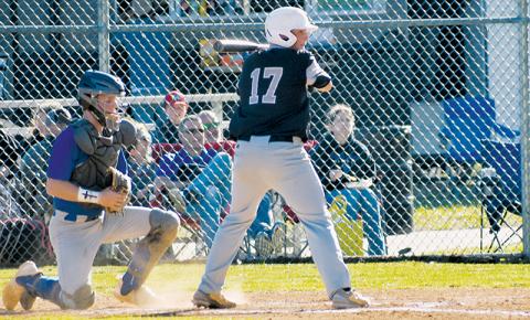 Ethan Orr patiently awaits his chance to swing Monday against Towns County, Ga. The next day, Orr homered and pitched a complete game for Robbinsville, helping lift the Black Knights to a 5-3 home win over Rosman. Photo courtesy of Fala Welch/Contributing Photographer