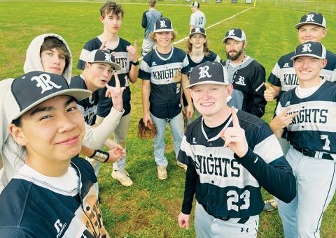 The Robbinsville Black Knights have good reason to smile: the team has recently put together its first winning streak of the season. Graylen Orr (2) struck out 10 Copper Basin batters in just four innings of work Monday, as Robbinsville made the streak official with an 8-7 win over the Cougars. Clockwise from Orr are Bryc  Garrison, head coach Brent Icenhower, Lathan Buchanan, Alex Knight, Caleb Turpin, Quinn Jumper, Preston Phillips, Ethan Orr and Bryce Adams. Photo by Kevin Hensley/sports@grahamstar.com