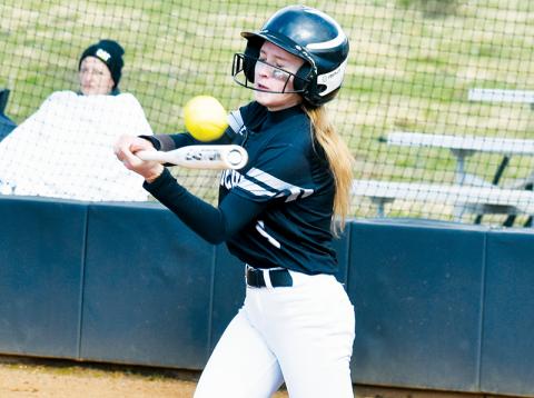 Khaygen Buchanan unleashes a hit for the middle school Lady Knights against Murphy on March 14. Photo by Kevin Hensley/sports@grahamstar.com