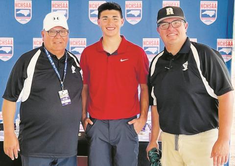 Robbinsville Black Knights sophomore Isaiah Brown stands proudly between his grandfather Jody (left) and Jeremy Brown at the 1A state golf tournament, which was held at Pinehurst No. 6 between May 15-16. It was Brown's inaugural foray into statewide competition.