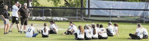 Despondent, the Robbinsville Lady Knights gather in left field for the final post-game meeting of the season May 17, following their third-round playoff exit at the hands of Union Academy. Photos by Montana Buchanan/The Graham Star