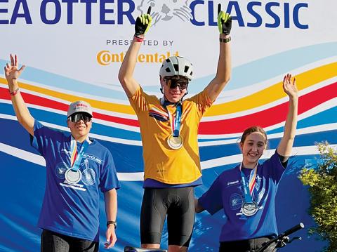 Snowbird native Ty Teasdale stands on the podium after winning the Grand National Cross Country Series’ Life Time Sea Otter Classic. Surrounding Teasdale are his teammates, Mitch Hawkins (left) and Ali Cardoza.