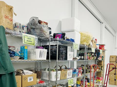 Though it may appear from this photo that plenty of food is in stock for free distribution at the Five Points Center, there can never be enough for those in need. Photo by Latresa Phillips/The Graham Star