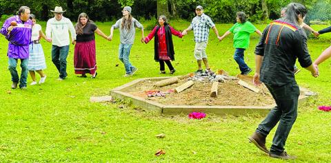 Eastern Band of Cherokee Indians member Bo Taylor leads a friendship dance around the mound at the Little Snowbird campground on Sept. 14. The “Earth Keepers” ceremony drew spectators from various countries across society. Photo by Latresa Phillips/The Graham Star