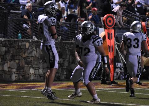 Roman Jones (15) and Tytan Teesateskie (72) celebrate Jones’ two-point conversion pass reception Friday at Cherokee. The snag capped the first scoring drive of the game for either team, with Robbinsville pouring it on from that point forward in a 46-6 rout of the Braves. Photo by Kevin Hensley/sports@grahamstar.com