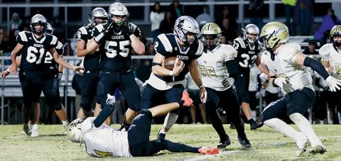 Black Knights senior Chase Calhoun leaves Hayesville’s Isaac Chandler lying in his wake Friday, while attempting to navigate through the Jackets defense. Calhoun later reeled in a 60-yard touchdown pass in the third quarter of Robbinsville’s 26-20 triumph. Photo courtesy of Miranda Buchanan/Robbinsville High School Yearbook