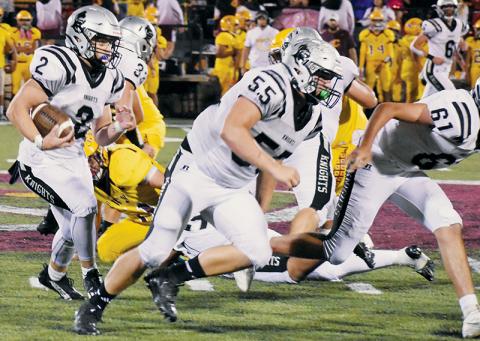 Chase Calhoun had his first 100-yard game in a Robbinsville uniform Friday, and he did it against his former school as part of a 46-6 rout at Cherokee. Running  interference for Calhoun are Koleson Dooley (55) and Isiac Collins (61). Photos by Kevin Hensley/sports@grahamstar.com