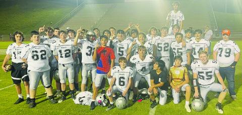 Moments after securing the program’s first outright JV conference title in over a decade, the Robbinsville Black Knights gather to  commemorate the victory at Swain County High School. Photo courtesy of Tonia Walsh/Robbinsville Middle School
