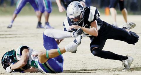 Tillman Adams (24) lowers the boom on Mountain Island Charter’s Caleb Shin during Robbinsville’s second-round playoff victory Nov. 9. Photos courtesy of Miranda Buchanan/Robbinsville High School Yearbook