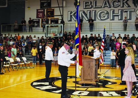 Members of both the Veterans of Foreign Wars Post No. 8635 and American Legion Post No. 192 begin the retiring of colors to wrap up Nov. 10’s Veterans Day recognition at Robbinsville High School. Photo by Ruby Annas/news@grahamstar.com