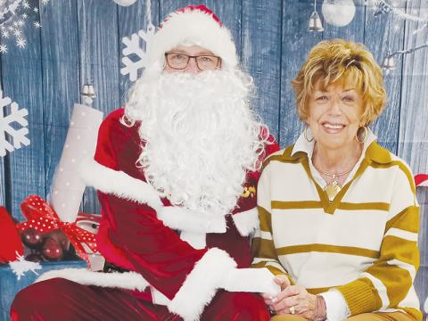 Maxine Williams meets with Santa at last year’s  Robbinsville High School Christmas Bazaar. Saturday, Williams will serve as the grand marshal of this year’s Christmas parade.