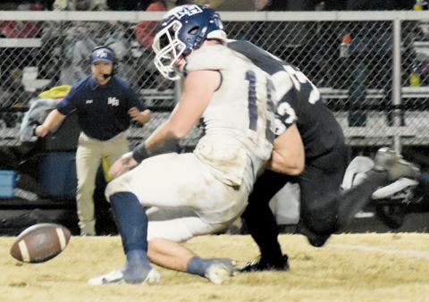 In the scramble for a fumble, Kage Williams laid a hard hit on Mount Airy’s Ian Gallimore. Photos by Fala Welch/The Graham Star