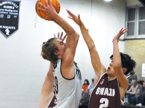 Cameron Allison – shown taking flight in Nov. 30’s home game against Swain County – produced back-to-back, 22-point performances in the last week for  Robbinsville’s 10-0, middle school Black Knights. Photo by Kevin Hensley/sports@grahamstar.com