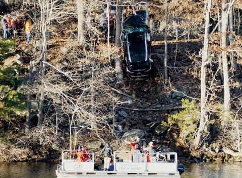 Workers finish extracting a 2016 Toyota Highlander that plunged into Lake Santeetlah on Jan. 19, 2023. Freddy Romero, 23, perished in the accident. Photo by Randy Foster/Community Newspapers, Inc.