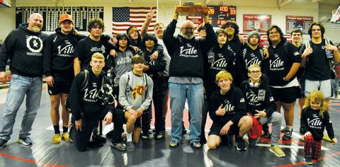 The Black Knights gather around the inaugural “Mill vs. The ‘Ville” trophy, which was brought back to Robbinsville on Dec. 28 in the wake of a huge dual victory at Pisgah. Photos by Kevin Hensley/sports@grahamstar.com