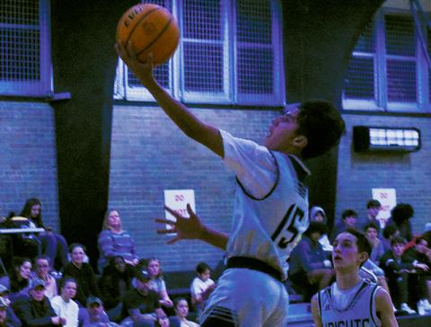 Amidst a first-quarter flurry, no one was at the basket to stop Xamuel Wachacha’s transition basket – and if they dared to interfere with the proceedings, Eli Lambert had a front-row seat to the bucket. Photo by Fala Welch/The Graham Star