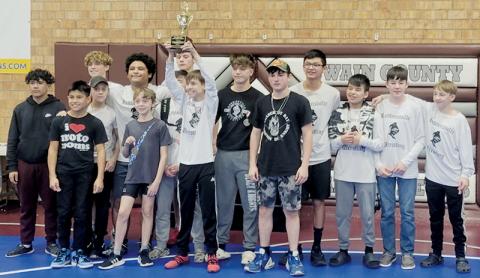 The Robbinsville Middle School Black Knights beam with pride after winning their third consecutive Smoky  Mountain Conference title Dec. 21. Photo courtesy of Robbinsville Wrestling