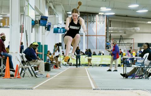 Lady Knights senior Zoie Shuler takes flight during the finals of Saturday’s state indoor track triple jump  competition. Shuler claimed her 4th triple jump state championship on her final attempt. Photos by Kevin Hensley/sports@grahamstar.com
