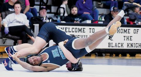 Lleyton Hooper has Mountain Island Charter’s Ethan Hayes searching for answers during the 144-pound bout of Saturday’s first-round playoff dual. Photo by Kevin Hensley/sports@grahamstar.com