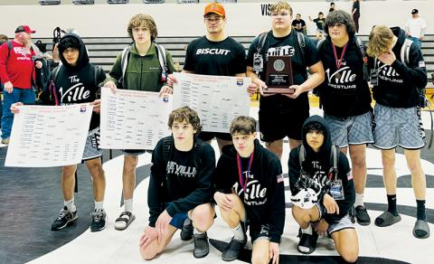 The Robbinsville Black Knights’ regional finalists display the 2023-24 1A Western  Regional Runner-Up plaque at the end of the two-day invitational. All names are listed from left. Kneeling in front: Lleyton Hooper, Skyler Anderson and Adair Panama. Back row: Alexis Panama, Loxston Hooper, Kage Williams, Koleson Dooley, Kellen Ensley and Avery Phillips. Photo by Audrey Colvin/The Graham Star