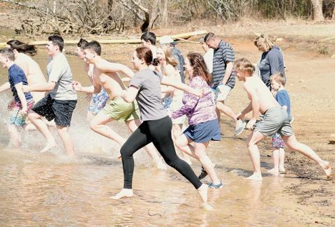 Over 20 participants sprinted full speed into Lake Santeetlah on Saturday, as part of the annual “Polar Plunge.” Photo by Kevin Hensley/editor@grahamstar.com
