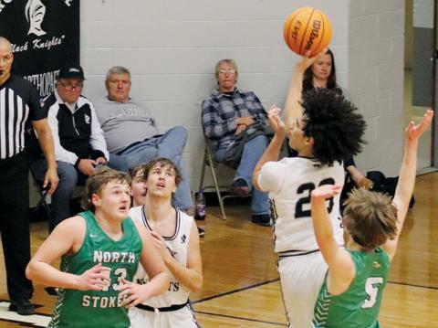 Darion Ledbetter turns to fire a second-half attempt Tuesday against North Stokes. Thanks to the Vikings, Robbinsville’s season came to an early halt in the first round of the state playoffs. Photo courtesy of Crystal White/Robbinsville High School
