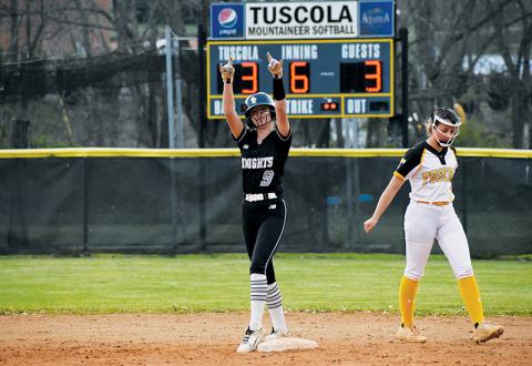 Sydney Adams signals to the dugout after smacking a 2-run, game-tying double Monday at Tuscola. The Lady Knights went on to defeat the Lady Mountaineers, 5-3. Photo by Kevin Hensley/sports@grahamstar.com