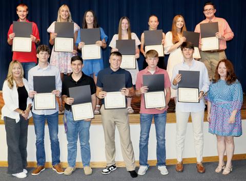 Twelve Robbinsville High School seniors were afforded scholarships totaling $52,000 on behalf of the Cody Family during the annual awards night May 21. All names are listed from left. Front row: Dana Cody Adams, Donovan Carpenter, Carter Burchfield, Cuttler Adams, Westin Nichols, Nathanael Shope and Amber Davis. Back row: Zeb Stewart, Karlee Stewart, Emma Beasley, Kalyn Cable, Aubree Nichols, Lindsay Batts and Aidan Holder. Photo courtesy of Crystal White/Robbinsville High School