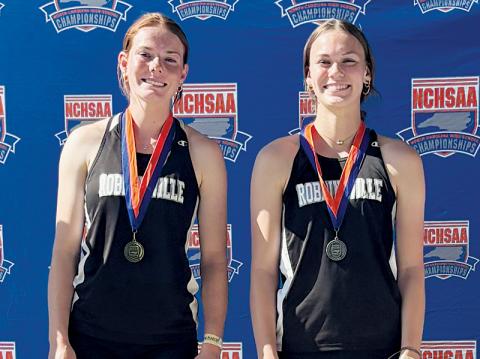 Lady Knights teammates Zoie Shuler (left) and Claire Barlow took the top two spots on the awards podium in the triple jump competition at Monday’s state championship meet. The happenstance was just one of many that left Robbinsville in high spirits at the conclusion of the gathering. Photo courtesy of Kylie Shuler