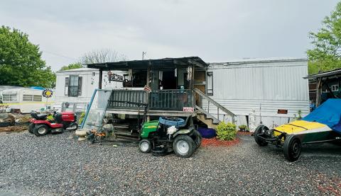 Graham County authorities raided this residence on Ward Street in Robbinsville on May 3 and uncovered a plethora of evidence. Two suspects were arrested. Photo by Kevin Hensley/editor@grahamstar.com