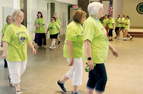 With temperatures Monday afternoon in the 90s, participants in this year’s Elder Abuse Awareness Walk called an audible and made laps around the Graham County Community Building’s meeting room, where a corresponding fair had just wrapped up hours earlier. Photo by Latresa Phillips/The Graham Star