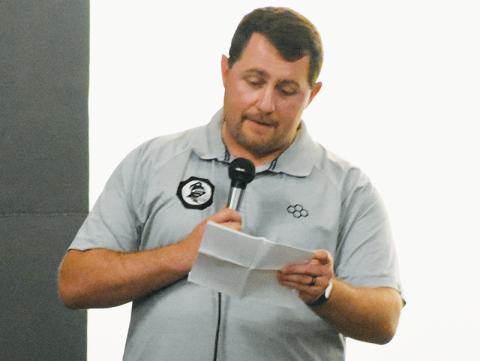 Colby White speaks at the June 5 Robbinsville High School wrestling state championship ring ceremony. The Graham County alum has been appointed the new head coach of the Black Knights’ powerhouse varsity grappling program. Photo by Kevin Hensley/sports@grahamstar.com