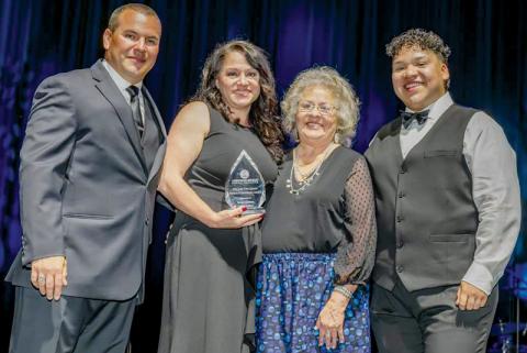 Graham County resident Susan Crowe (second from left) was presented with the Lula Owl Gloyne Person of Excellence Award at the June 15 Cherokee Indian Hospital Foundation Gala. Also pictured is Dale Robinson, Jr. (left), chairman of the Cherokee Indian Hospital Foundation; plus Judy Gloyne-Tiger and Jayden Crowe (right), family members of Lula Owl Gloyne.