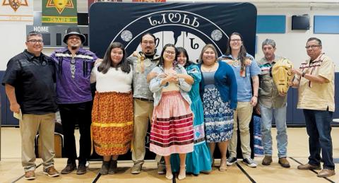 Cherokee County/Snowbird Tribal Council Rep. Adam Wachacha (far left) and Roger Smoker (far right) gather around the six latest graduates of the Dadiwonisi Language Program, all of whom were recognized at a Monday ceremony. In-between Wachacha and Smoker (from left) are language  instructor Cassidy Galaviz, Callie Bush, Malakai Littlejohn, Lauryn Rattler, Rachel Ballou, Lakoda Bird, Troy Jones and Mike Wachacha. Photo courtesy of April Johnson/Contributing Photographer