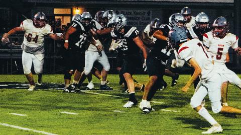 Roman Jones (15) works through the front-line battle Sept. 12 against Copper Basin. Jones eclipsed the 250-yard mark and recorded all four of Robbinsville’s touchdowns at Trion, Ga. Photo by Royce Worbington/The Graham Star