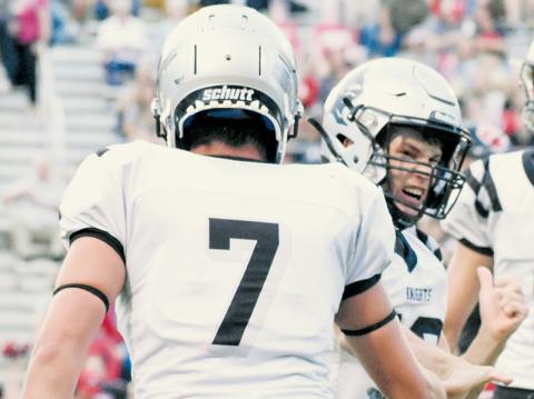 Senior Tanner Hedden was all fired up after dropping Braydon Hervey for a first-quarter loss Friday. Giving kudos to Hedden for the stop is Isiac Collins (7). Photos by Kevin Hensley/sports@grahamstar.com