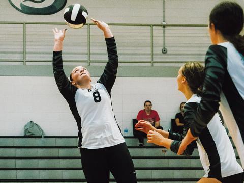 With Claire Barlow (center) and Chloe Adams scrambling to get into position, junior setter Ryn Hooper makes a pass during Aug. 20’s home match against Highlands. Photo by Royce Worbington/The Graham Star