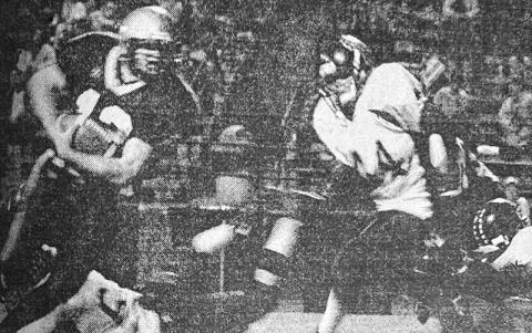 In this photo from the Halloween 2002 edition of The Graham Star, Zach “Bear” Chekeleelee (44) charges at a Hayesville runner.