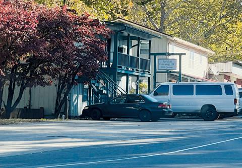 The bodies of two men were found deceased inside a second-floor apartment attached to this business Monday. Photo by Kevin Hensley/editor@grahamstar.com