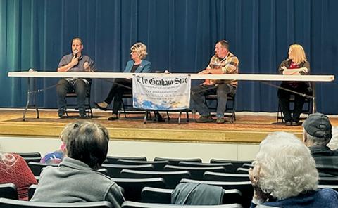 Incumbent commissioner Lynn Cody answers a question during Saturday's candidate forum at Robbinsville High School. Seated with Cody (from left) are incumbent commissioner Connie Orr, Thomas Menard and Meggan Smith. Photo by Latresa Phillips/The Graham Star