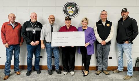 Rep. Karl Gillespie (R-Franklin; second from right) visited Graham County Schools on Friday, to formally present a check in the amount of $42 million from the North Carolina Department of Public Instruction. The grant money will go toward the construction of a new Robbinsville Elementary School. Photo by Kevin Hensley/editor@grahamstar.com