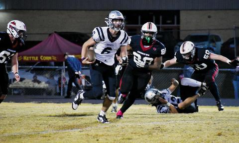 Bryce Adams evades the pursuit of Andrews’ Antonio Hernandez during Friday’s 28-7 win over the Wildcats. Photo by Bella Eddings/The Graham Star